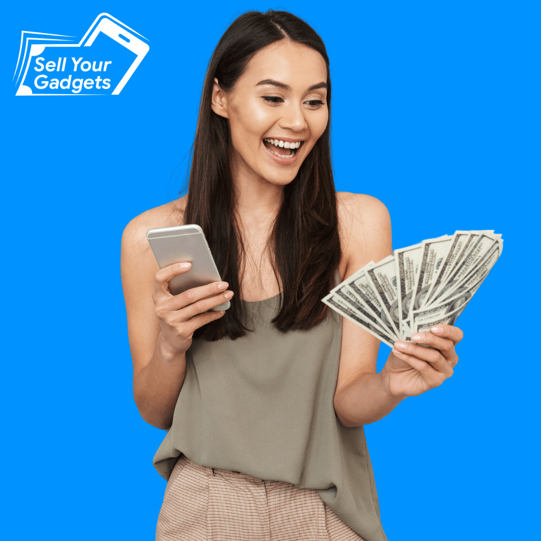 Customer with cash and her phone at a Sell Your Gadgets store